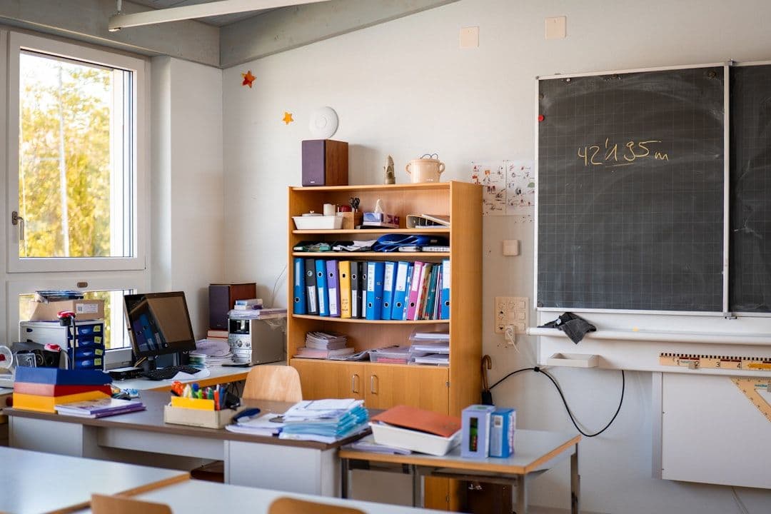 Teacher using school management software to manage classes and student data
