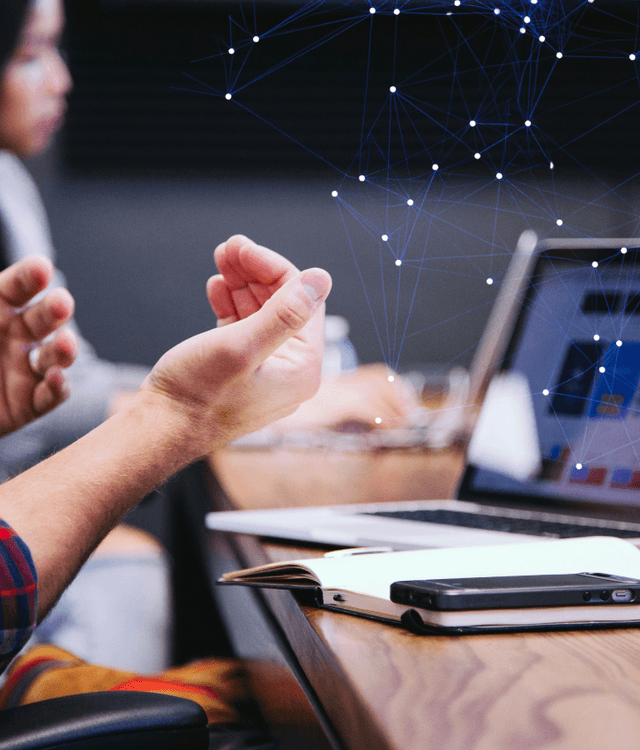 AI product design and UX illustration with team collaborating on laptops and digital network overlay, representing AI-driven user experience innovation and intelligent product design services.