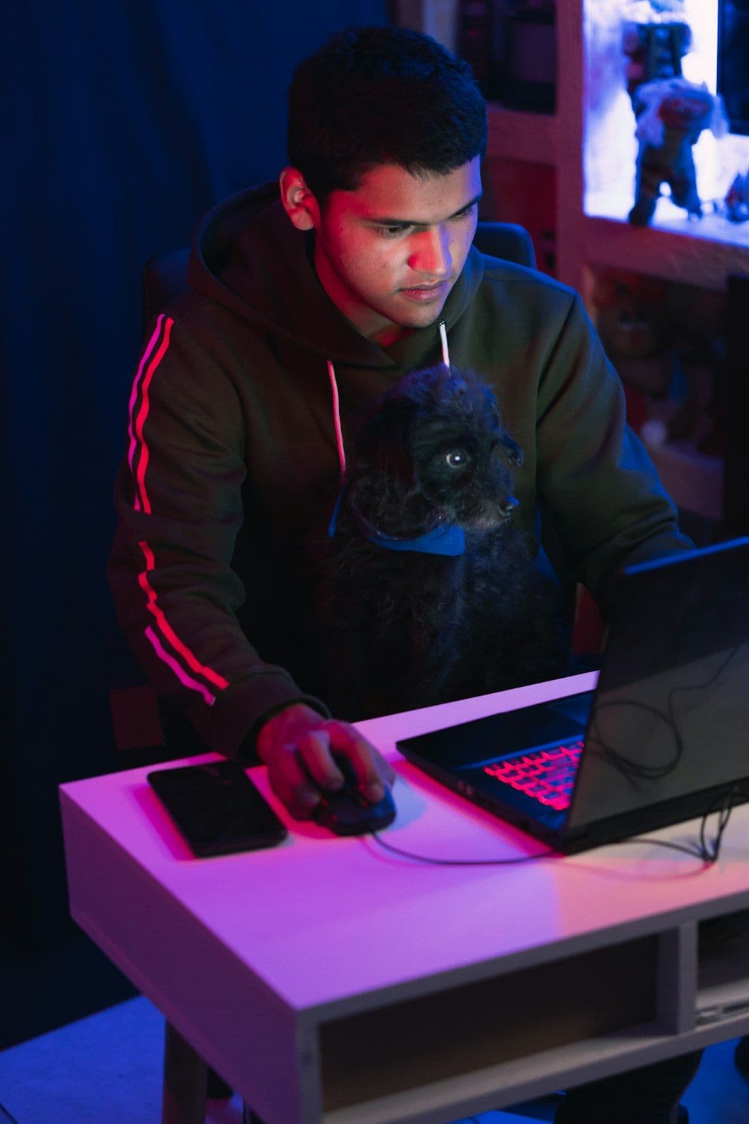 Person analyzing game analytics on a computer in a studio setting