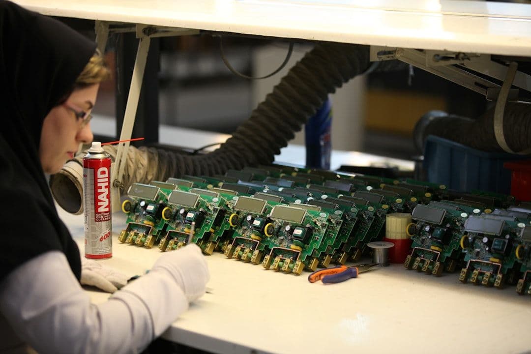 Close-up of a technician adding connectivity to industrial OEM products