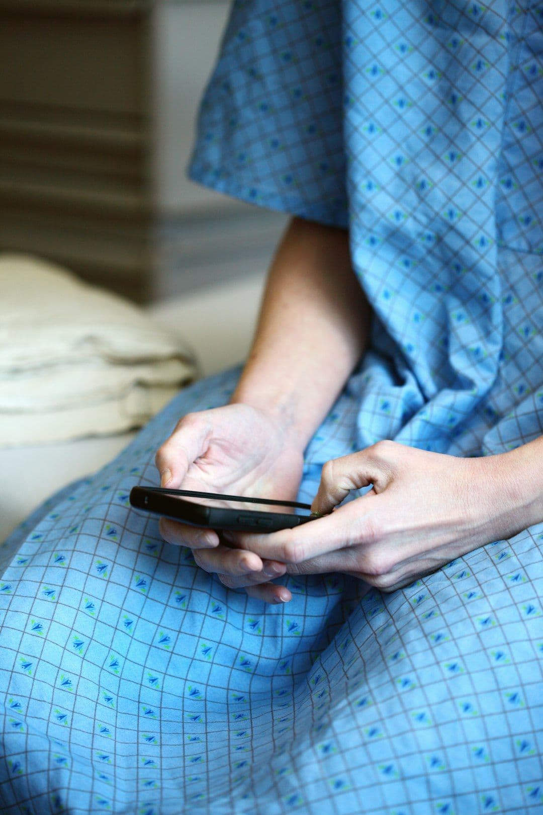 Patient accessing healthcare mobile app on smartphone