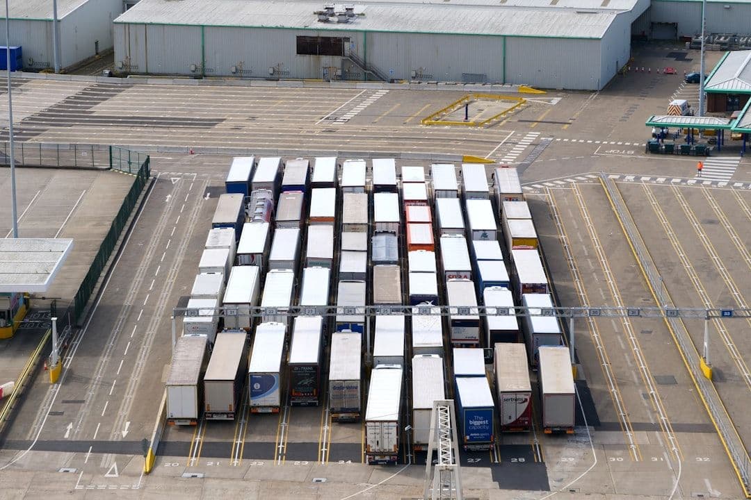 Fleet of delivery trucks and warehouses in an industrial setting