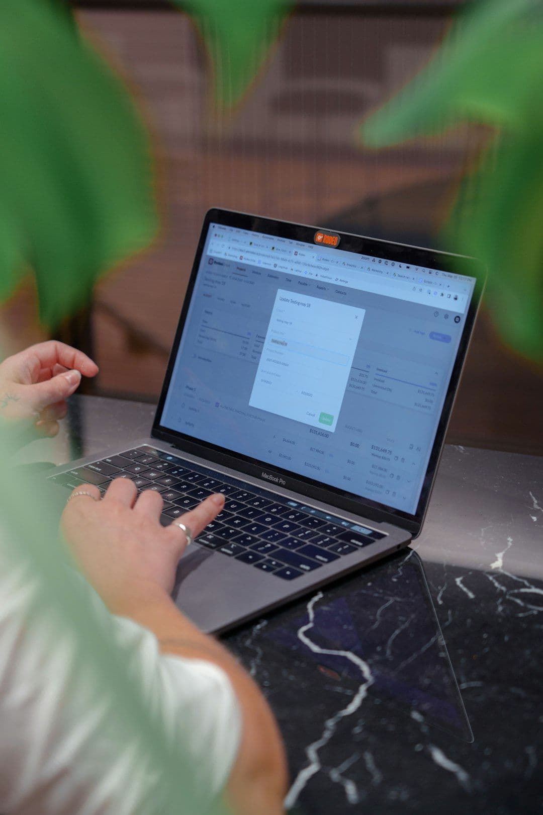 Person using student assessment software on a computer