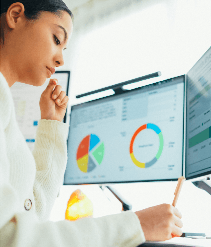 Software maintenance and support illustration with analyst monitoring performance dashboards, symbolizing application optimization and ongoing software support services.