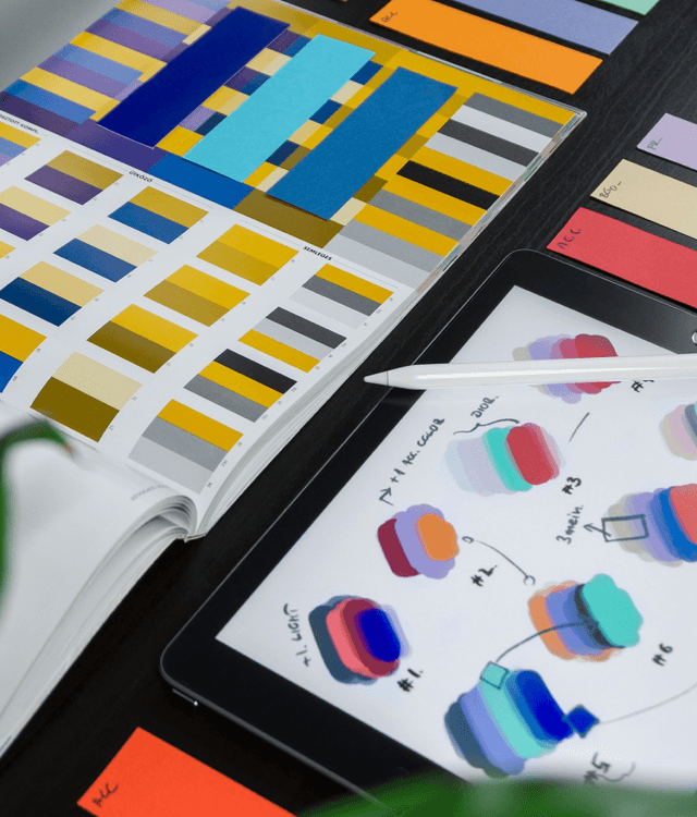 Design systems illustration with digital sketches, UI components, and color palettes, representing scalable design systems and consistent interface implementation services.
