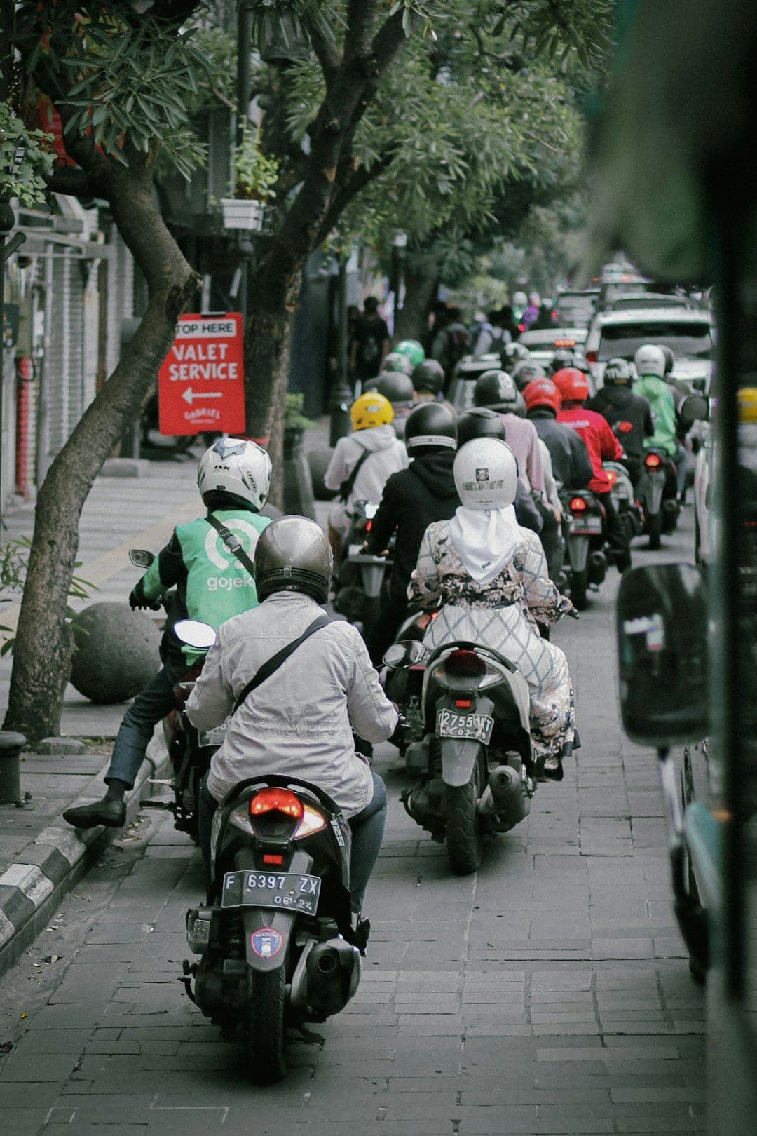 Illustration of a diverse group of people using a ride-hailing app for transport cooperatives